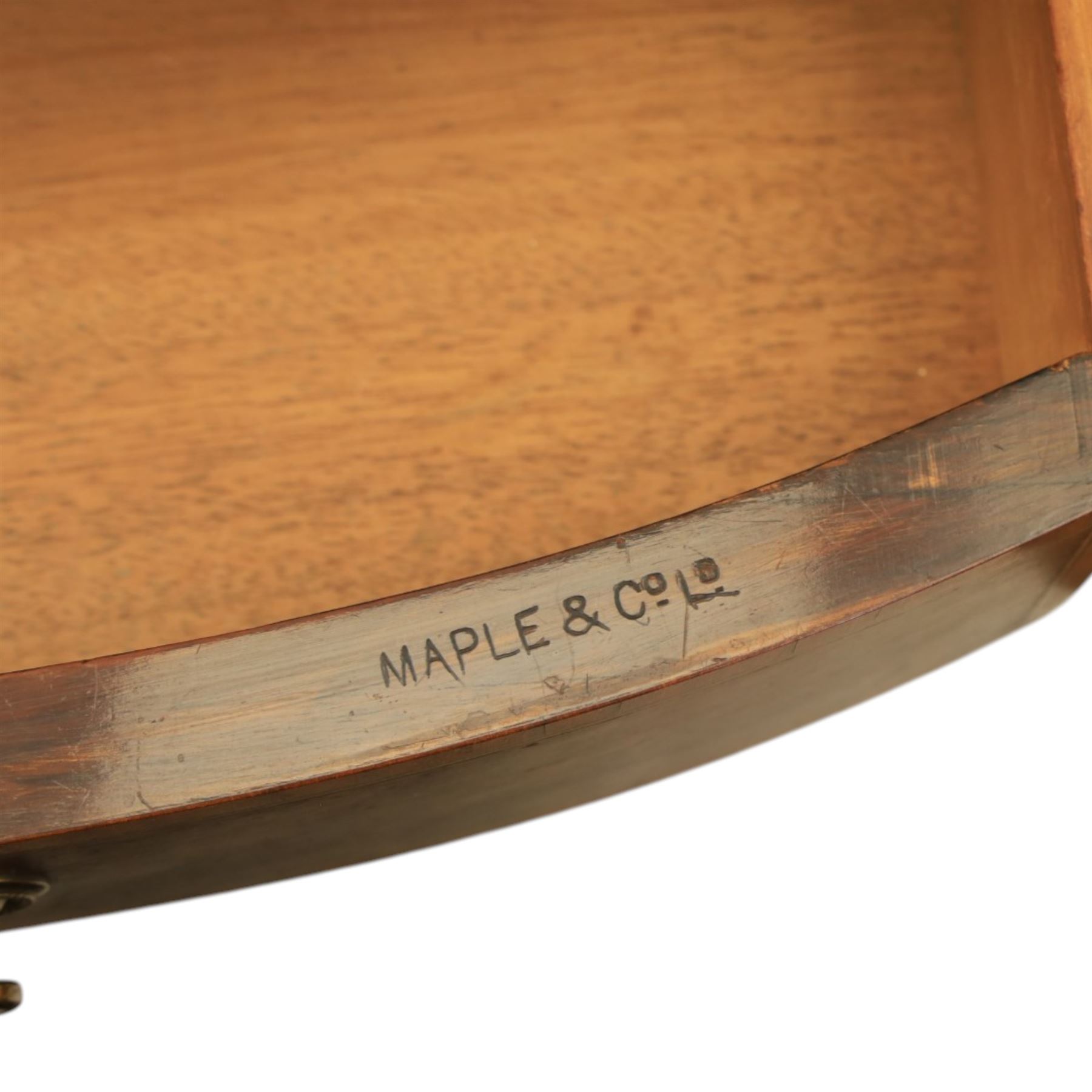 Maple & Co - Edwardian mahogany inlaid writing desk, the superstructure with pierced brass gallery, above an inset mirror and two short drawers, inset leather writing surface, bow fronted with crossbanded drawers and brass swan neck handles, square tapering supports terminating in castors 