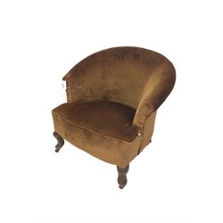 Early 20th century tub shaped armchair, upholstered in chocolate brown velvet fabric with sprung seat, raised on cabriole supports with castors