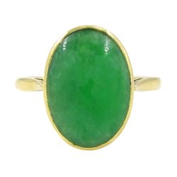 Early - mid 20th century gold jade ring, bezel set with a single oval cabochon jade of app...