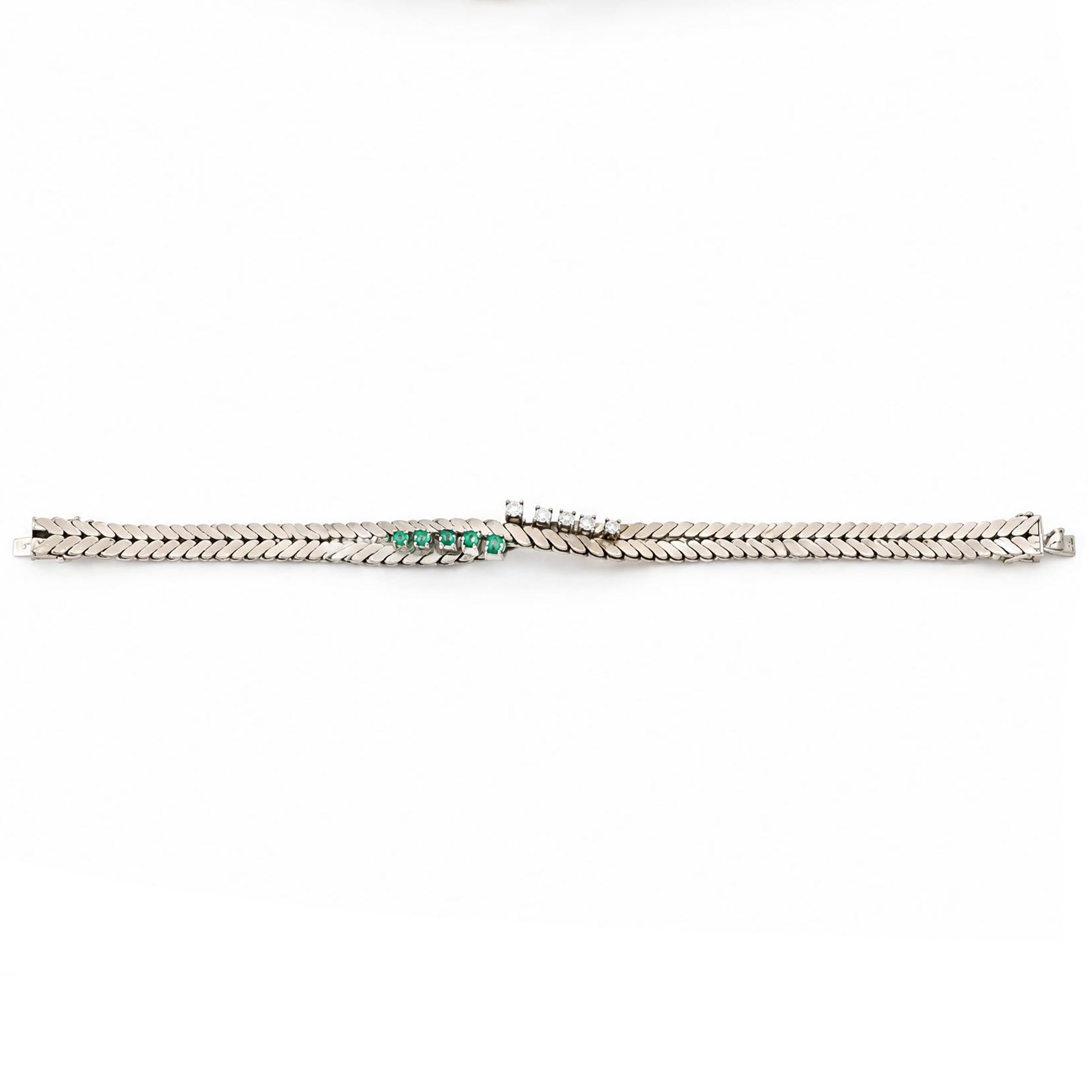 14ct white gold diamond and emerald crossover bracelet, the central section set with five graduating round brilliant cut diamonds and five emeralds, to a chevron link bracelet, stamped 585, total diamond weight 0.35 carat