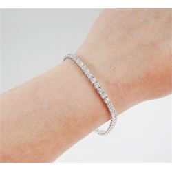 18ct white gold diamond bracelet, four claw set with fifty-one round brilliant cut diamonds, stamped 750, total diamond weight approx 6.35 carat