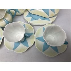 Shelley Dainty pattern tea wares, of lobed form with blue star decoration on merging white and yellow ground, comprising five teacups, five saucers, six tea plates, milk jug and cake plate, all with printed green mark beneath, some with painted pattern no 11770