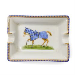 Hermès - set of four miniature porcelain ashtrays, each decorated with a horse in differing blanket, with gilt and coloured borders, in contrasting colour with various horse-coats, in original fitted box