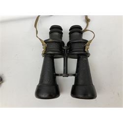 Pair of WWII German U-boat binoculars probably 7 x 50 by Leitz, with rubber eye piece protector covers and leather case stamped with Kriegsmarine mark to the lid and dated 1944, with leather strap.