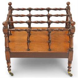 Victorian mahogany canterbury, four division top with bobbin turned rails and spindle uprights, rectangular base with moulded edge, on turned corner supports with brass castors