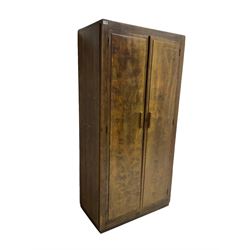 Early 20th century scumbled wood wardrobe, two panelled doors enclosing shelf over hanging rail