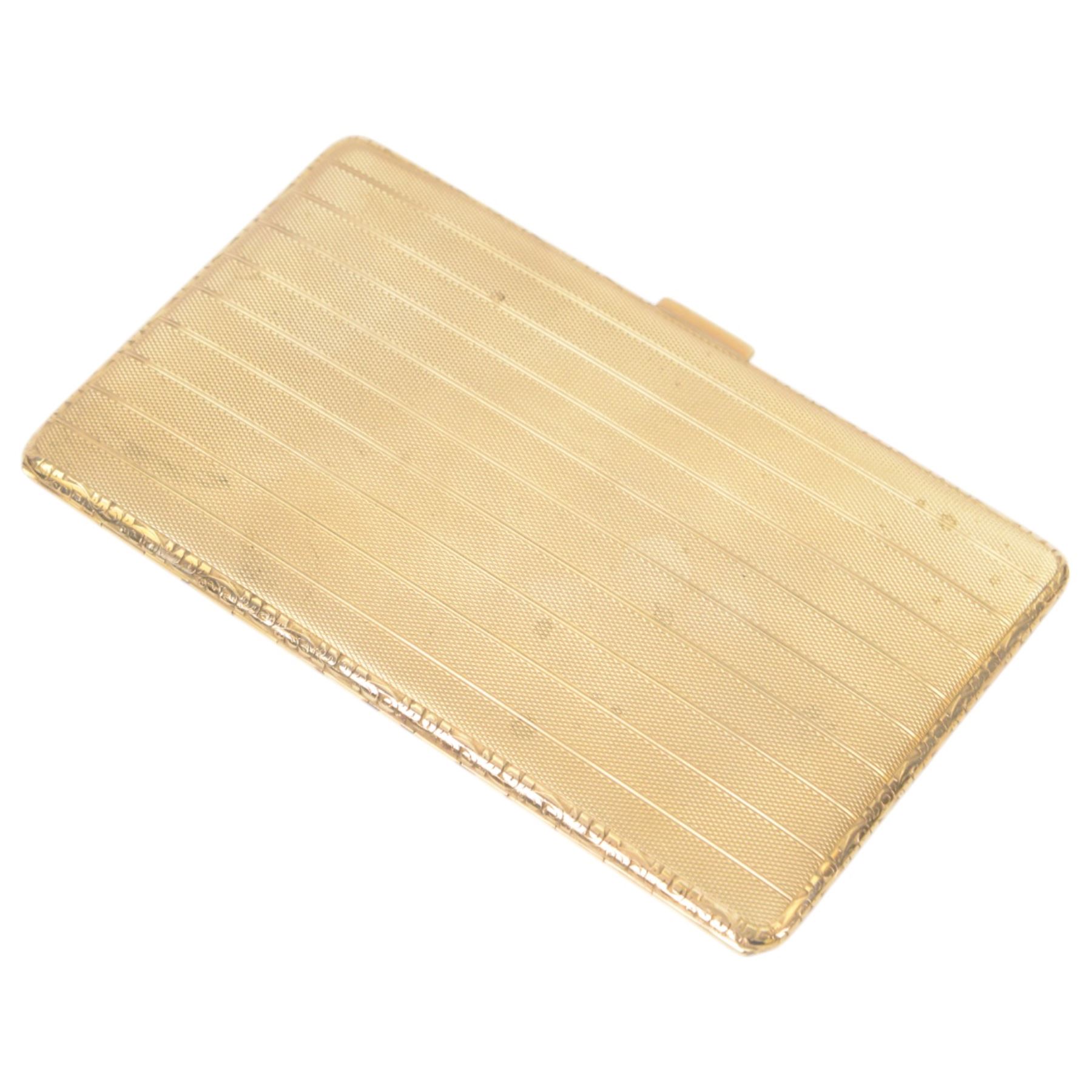 Early 20th century 9ct gold cigarette case, of rectangular form with vertical engine turned decoration, hallmarked Charles S Green & Co Ltd, Birmingham 1935, also marked 9 375, H14cm W8.5cm

