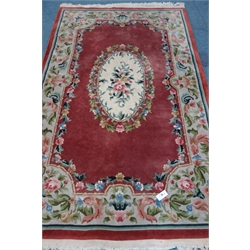 Chinese beige gorund rug, central medallion with red field and border, repeating floral and foliate pattern, 240cm x 150cm  