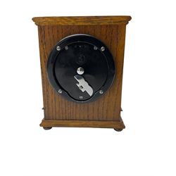 Elliot - oak cased 1950’s 8-day timepiece mantle clock, with a balance wheel movement wound and set from the rear, flat topped case with a carved panel raised on bun feet, square brass dial, silver chapter ring, spandrels and  decoratively engraved dial centre inscribed “Bracher & Sydenham, Reading”