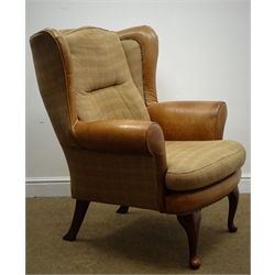  Wing back armchair, scrolling arms, upholstered in check fabric and tan leather, cabriole legs with pad feet, W86cm  
