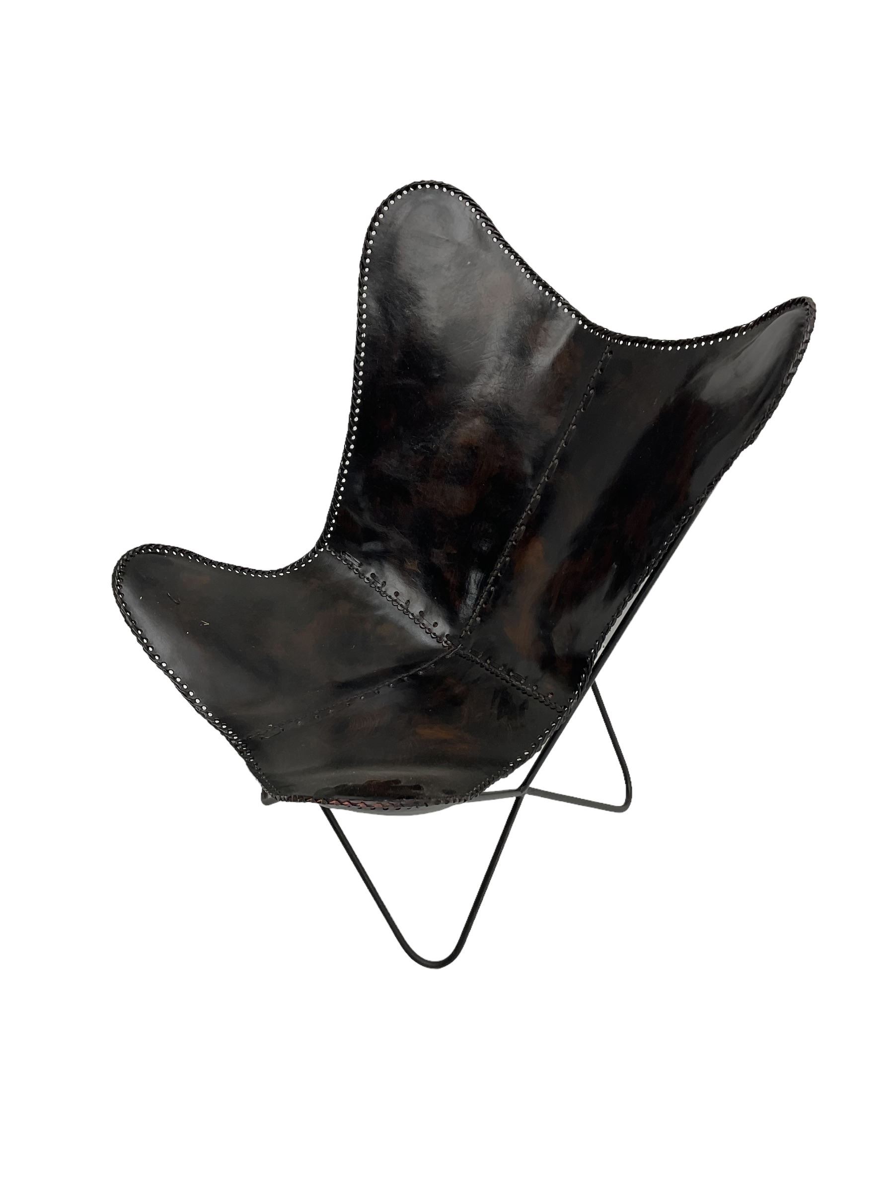 Butterfly Chair, black finish metal frame with stitched slung leather cover