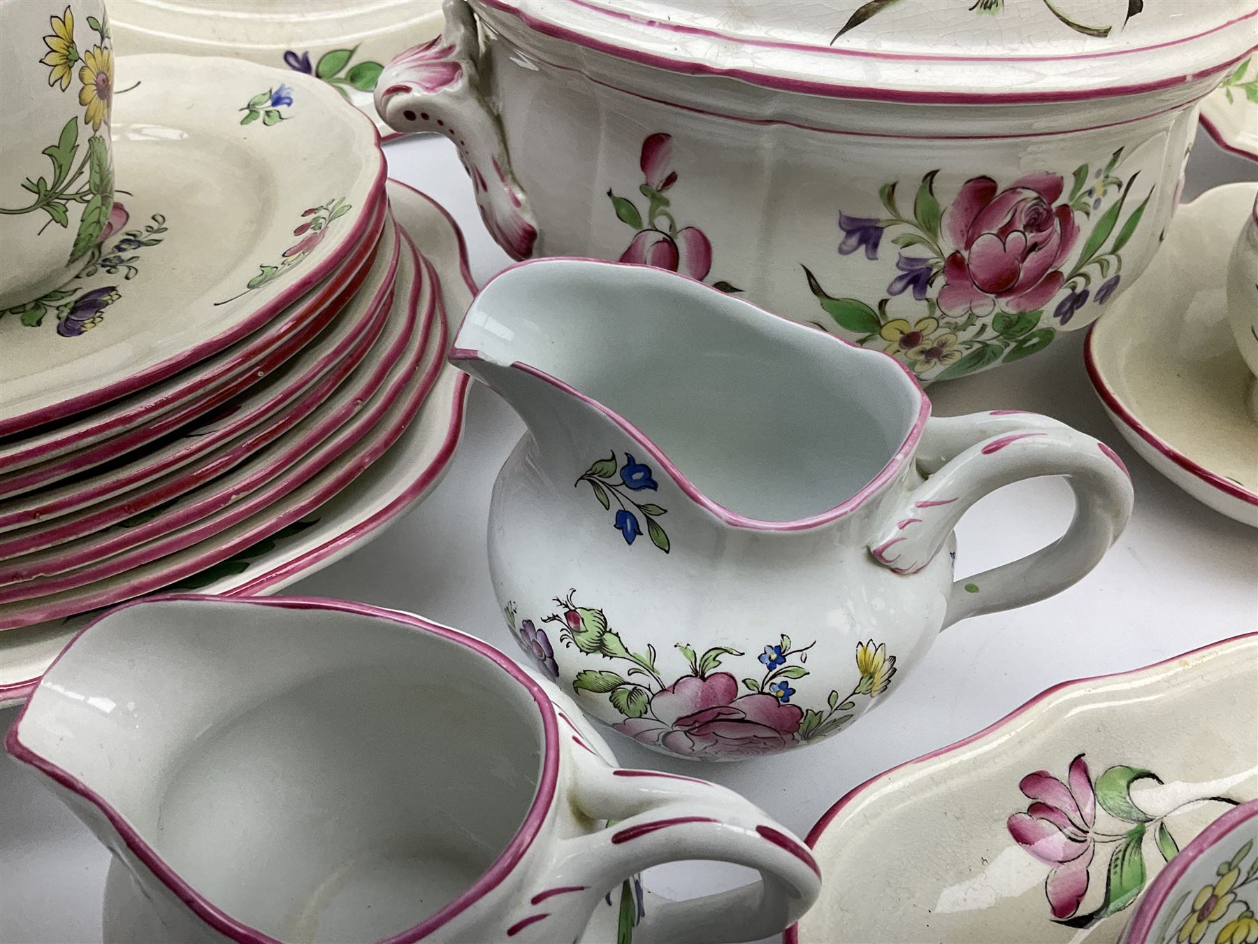 Matched Copeland Spode, Spode and French Luneville and Marlborough Sprays pattern dinner and tea wares, comprising two tureen and covers and apple finials, two sauce tureen and covers with pear finials and fixed stands, six graduated platters including two pairs, large plate, thirteen dinner plates, twelve bowls, ten smaller bowls, eight side plates, eleven smaller side plates, teapot, twin handled sucrier and cover with apple finial, open sucrier, cream jug, smaller cream jug, four breakfast cups, eight tea cups, four large saucers, eleven smaller saucers, and nine further smaller saucers. 