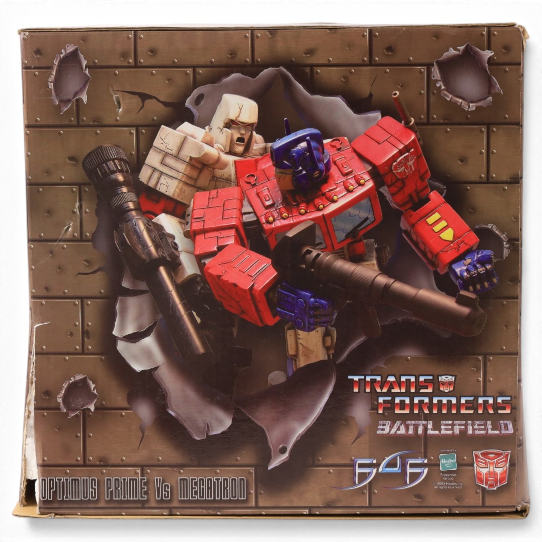 First 4 Figures Transformers Optimus Prime vs. Megatron model, together with a Hasbro Transformers Bumble Bee bust and a Hasbro Transformers Alarm Clock, all boxed