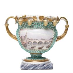 Pair of 19th century Grainger Lee & Co Worcester urns, c1820s-1830s, hand-painted with views of 'Near London Bridge' and 'Brighton Pavilion' upon a ground of encrusted forget-me-not decoration, the beaded rim with twin naturalistically formed handles, leading into vines moulded with strawberries in high relief, the pedestal painted to imitate marble, painted marks to base, H20cm