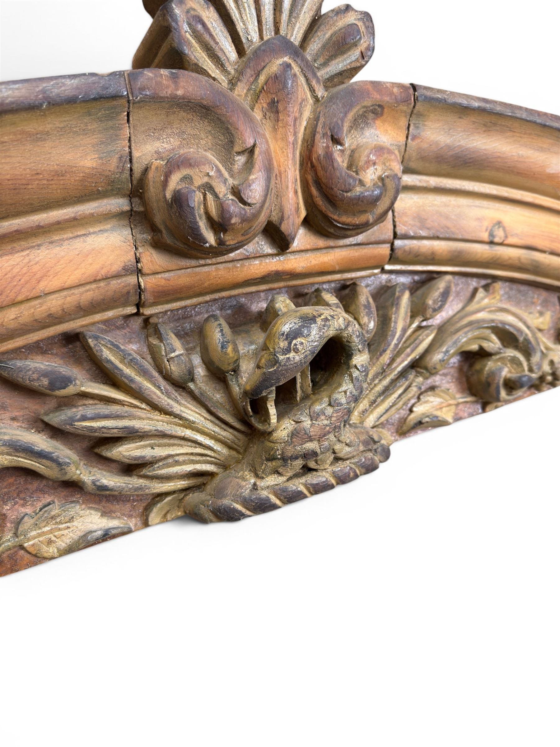 19th century carved pine architectural pediment, detailing floral swags with berries and central serpentine snake head 