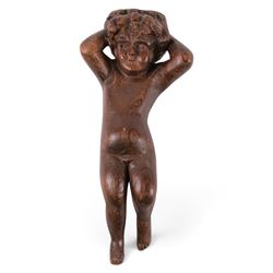 18th century carved oak cherub, with hands raised behind head, H26cm 