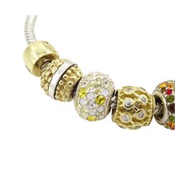 Chamilia 14ct gold and silver charm bracelet, silver bracelet, with 14ct gold and silver finials, six 14ct gold charms including cubic zirconia, four silver charms and two silver and 14ctgold charms, boxed