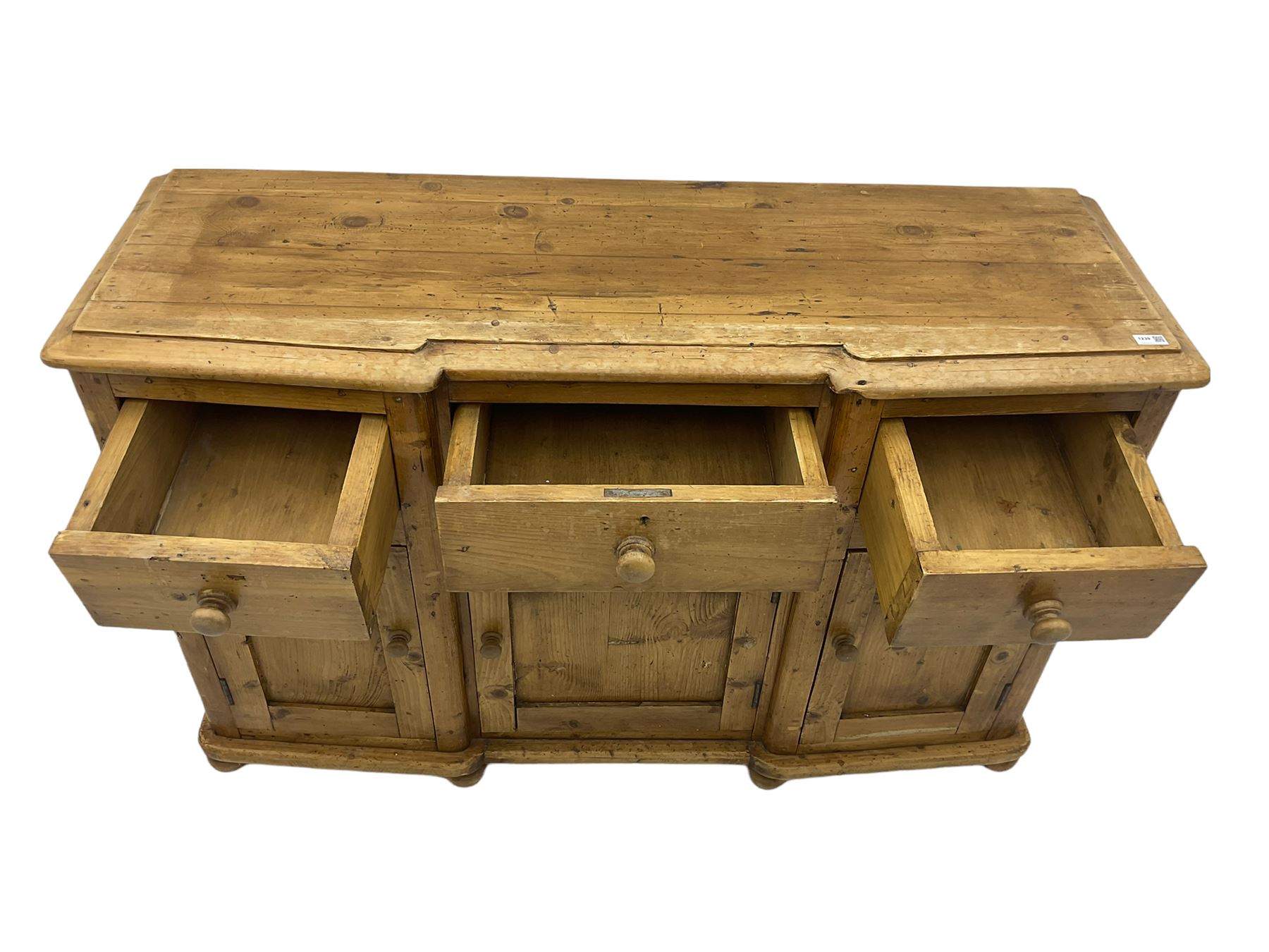 Stripped pine dresser, fitted with three drawers and three cupboards