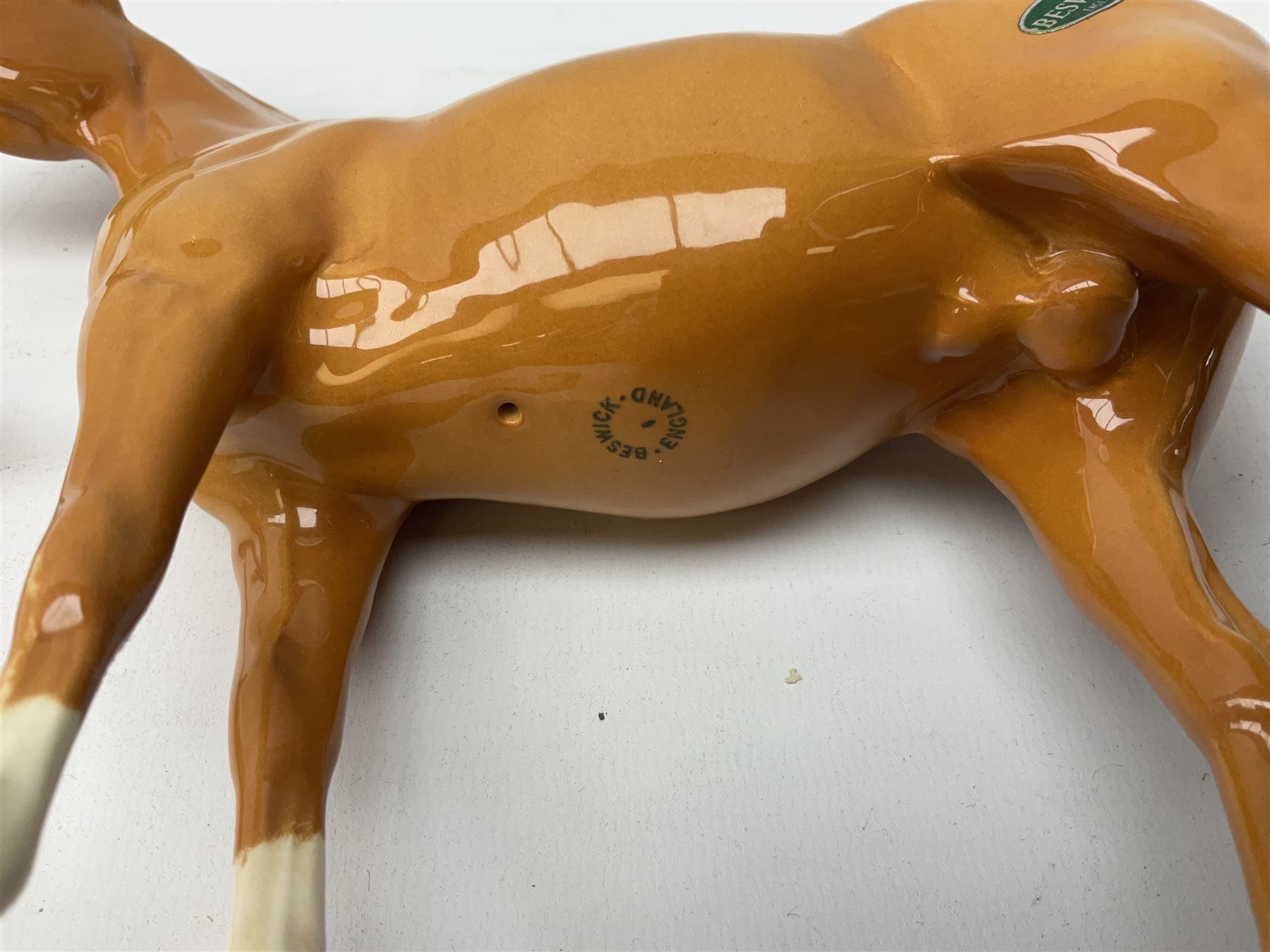 Collection of Beswick horses, including grey horse no.701, palomino foal no 836, grey stocky jogging mare no.855 etc, together two Royal Doulton horses, (8)