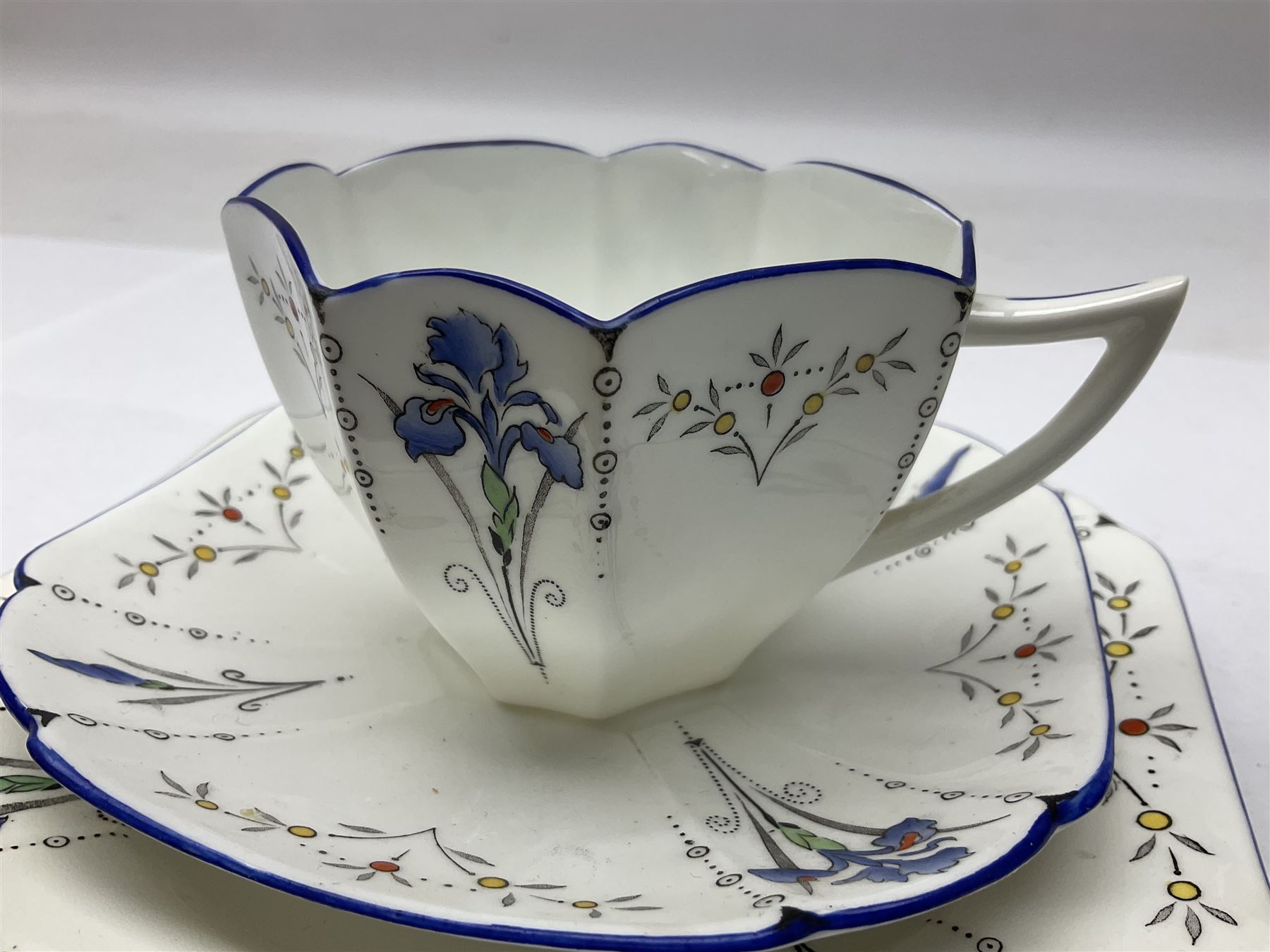 1920s Shelley Queen Anne shaped trio, decorated in the Blue Iris pattern no. 11561, ith printed mark beneath 