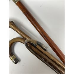 Five walking sticks, to include three silver mounted examples 