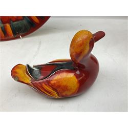 Collection of Poole Pottery, comprising charger and vase in Volcano pattern and a duck figure in a similar pattern 