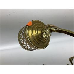 Brass adjustable wall light with a pierced shade and scroll decoration, L37cm 