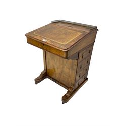 19th century walnut davenport, the top with gilt gallery over sloped hinged top, the interior fitted with small drawers, the right-hand side fitted with four drawers, on sledge feet with castors