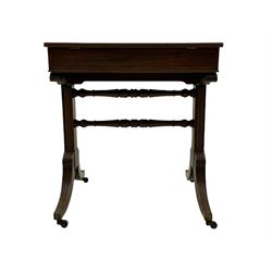 Regency mahogany rise-and-fall architect's table, adjustable hinged top on brass mechanism with reeded edge moulding, plain recessed frieze panels concealing full length drawer with division and slide at each side, moulded solid end supports joined by two turned stretchers, on splayed and tapering lobe carved supports with brass cups and castors 