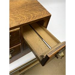 Early/mid 20th century oak four drawer library card index cabinet, of tapering form with brass index card holders and pull handles, H29cm D45cm W33cm