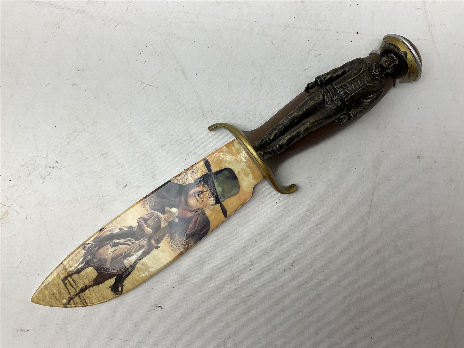 The Bradford Exchange John Wayne bowie decorative knife, L27cm and John Wayne Tall in the Saddle Galloping Thunder figure group