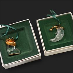 Twelve Swarovski crystal 'Christmas' and 'Crystal' Memories ornaments, comprising Moon, Sun, Boot, Candy Cane, Christmas Wreath, Pinecone and Holly etc, boxed and with sleeves (12)