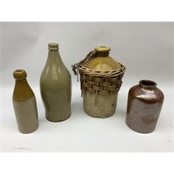 19th century stoneware gin bottle impressed I. Peck, Spirit Merchant Hull H27cm, Victorian salt glazed stoneware jar embossed W. Jefferson Mustard Manufacturer 47 Wincolmlee Hull, part cane covered stoneware flagon for John Smith Market Place Beverley and a Barton-on-Humber stoneware ginger beer bottle (4)  