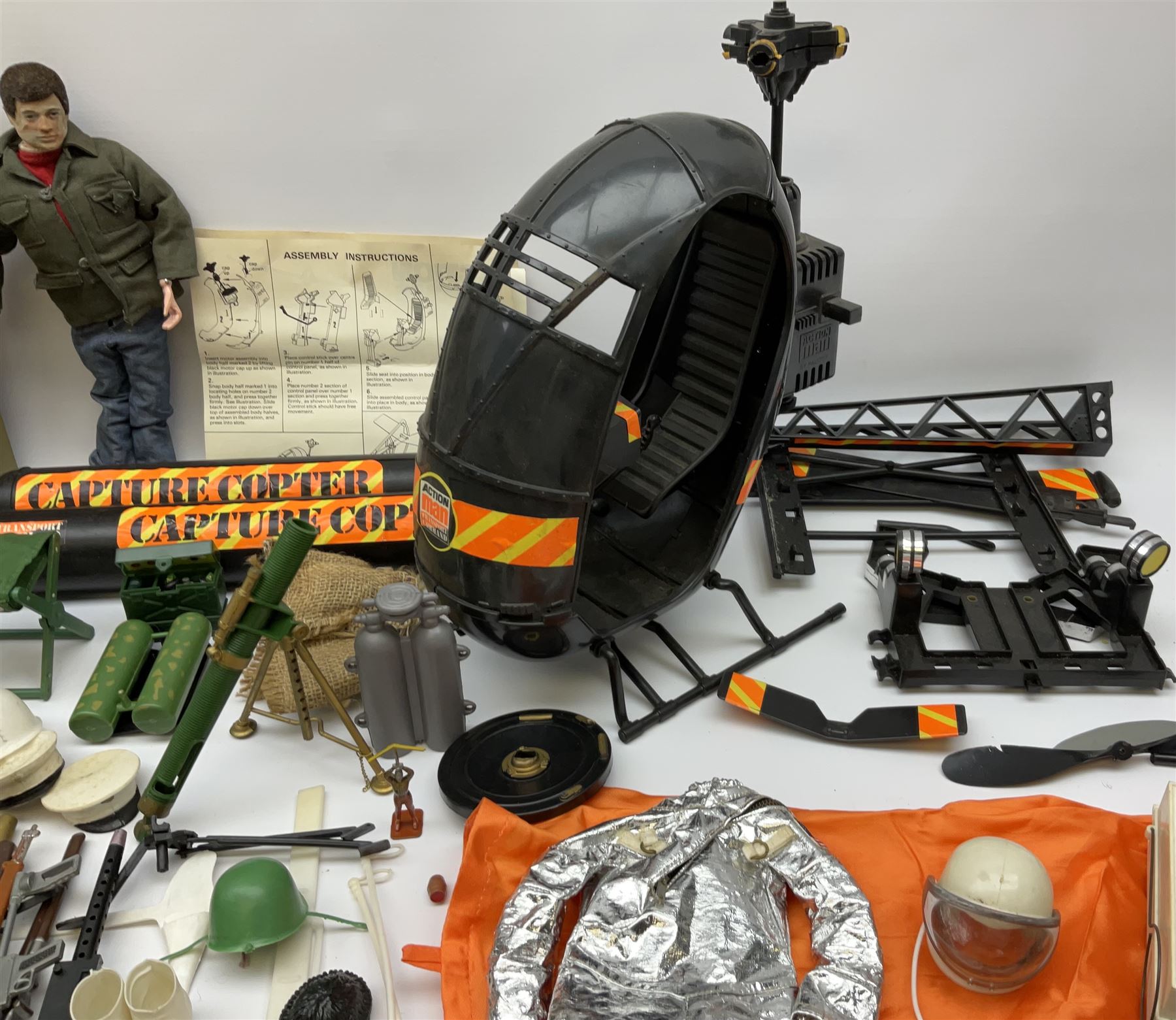 Action Man - one figure, boxed Assault Craft, dismantelled  Capture Copter, two bags of equipment and accessories etc