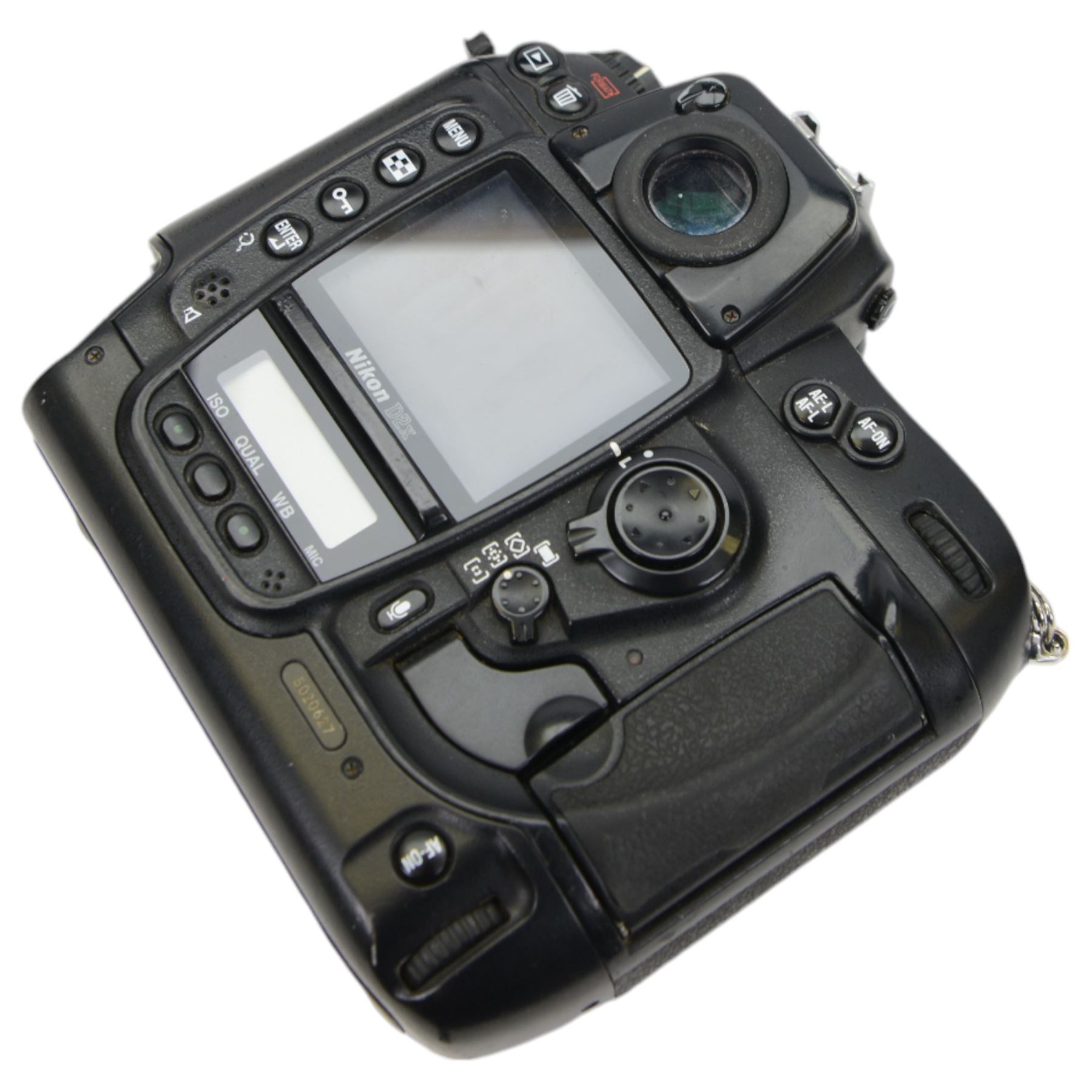 Nikon D2x digital SLR camera body, serial no. 5020627, with some associated battery packs and accessories