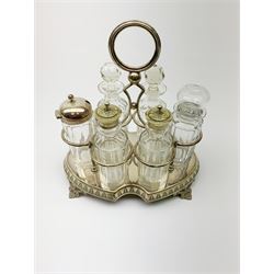 A silver plated and glass six piece cruet/condiment set, the stand with shaped feet and carry handle, H23cm. 