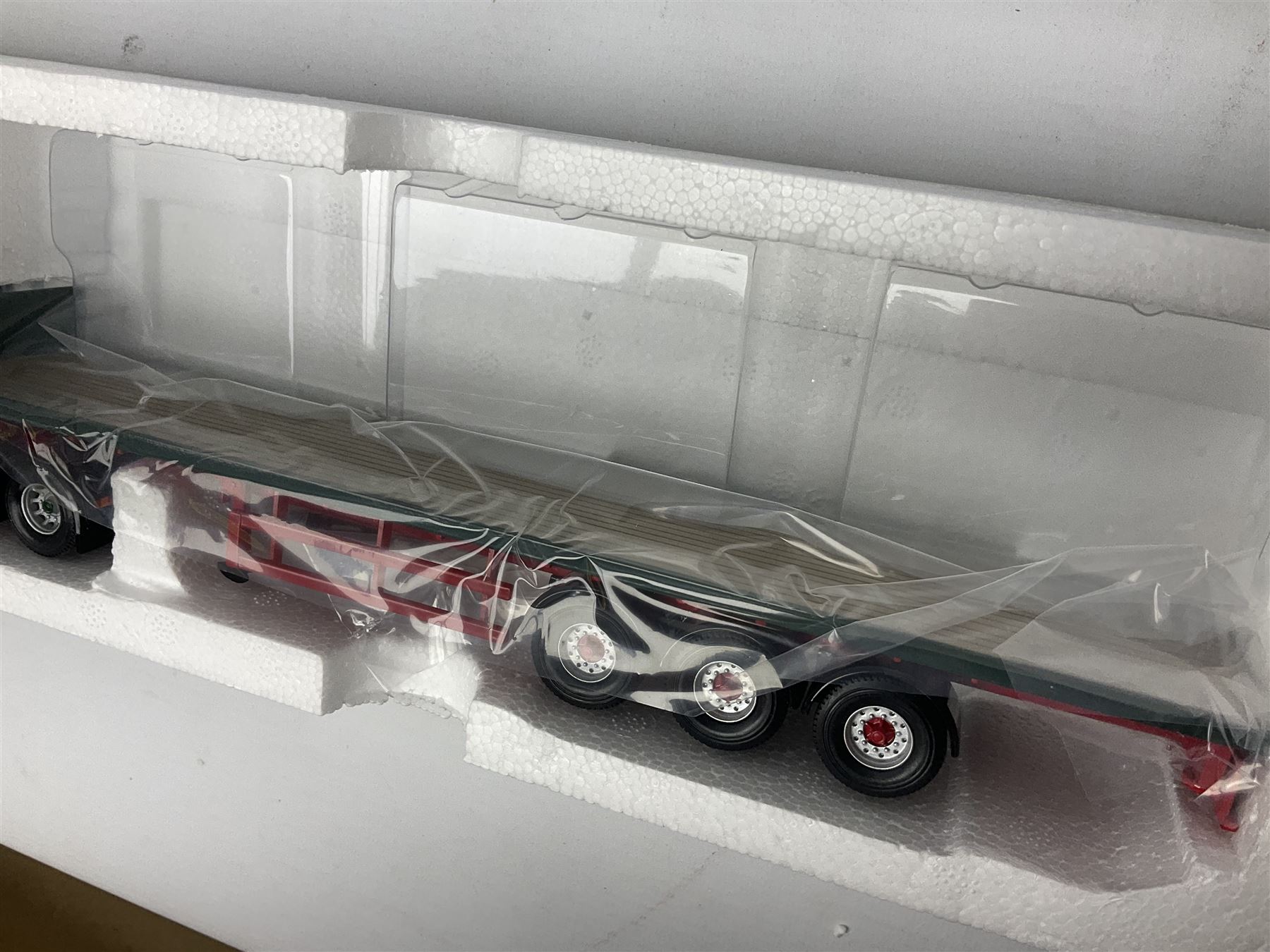 Corgi Eddie Stobart - three limited edition lorries; CC12901 Scania Topline Curtainside; CC13101 Volvo F88 Box Trailer; and CC13207 DAF XF Space Cab & Flatbed Trailer; all boxed (3)