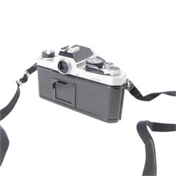 Nikon FM SLR camera body serial no. 2253063, together with a Nikkor 50mm 1:1.8 lens serial no. 2154684, Nikon Series E 75-150mm 1:3.5 zoom lens serial no. 3060109 and an Ohnar zoom slide duplicator