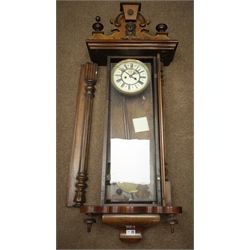  Late 19th century walnut cased Vienna wall clock, twin train movement striking on coil, with weights and pendulum  