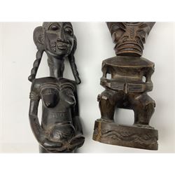 Carved african figures, together with a polynesian figure, largest H38cm