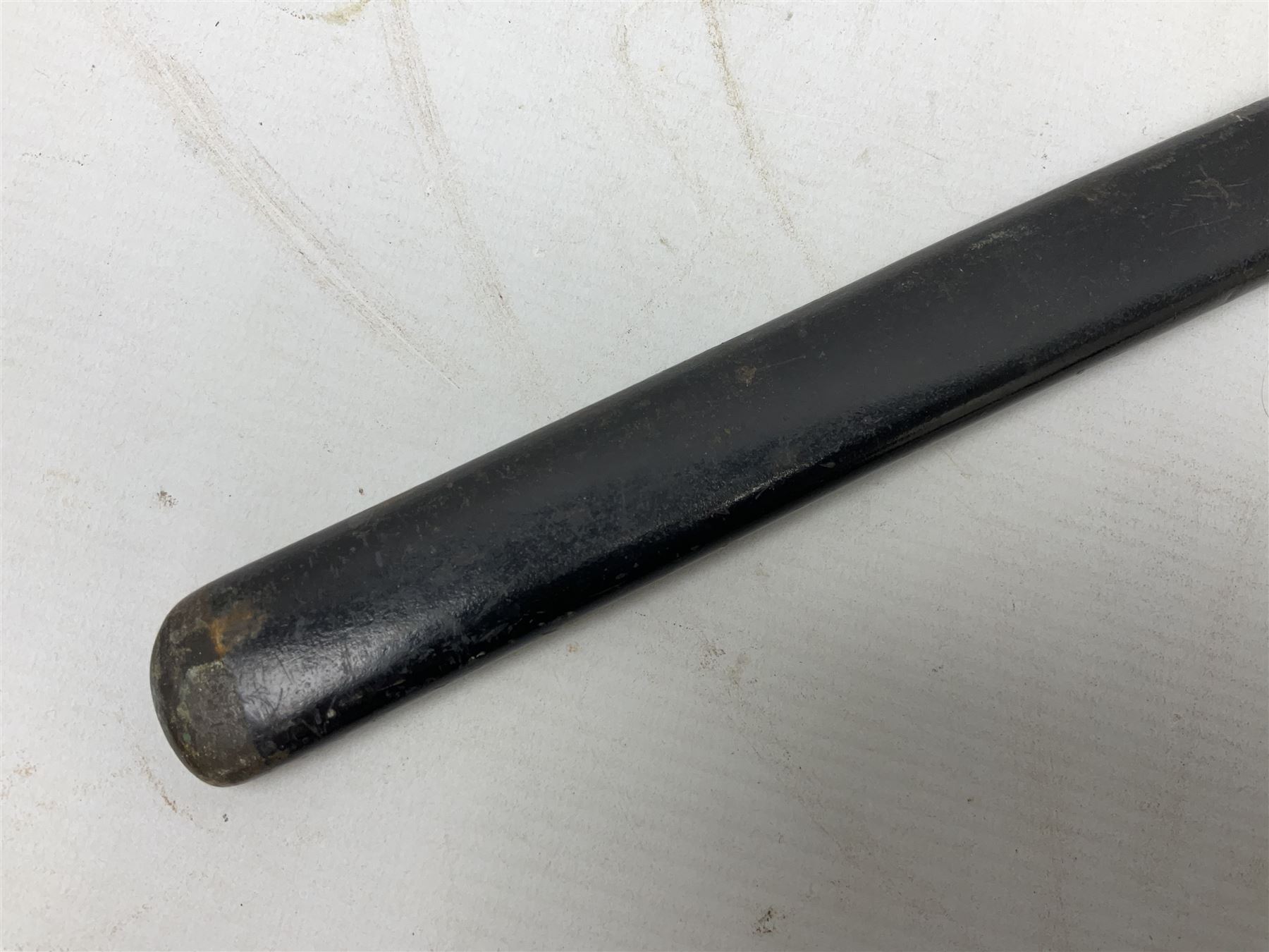 WW2 Japanese Army NCOs sword - katana, the 69.5cm slightly curving fullered blade numbered 14656; arsenal markings stamped near the habaki on the handle; brass tsuba and black painted metal hilt cast to simulate cord bound fish skin; in black painted steel scabbard with single suspension ring L96cm overall