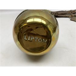 Victorian Queen Victoria record reign horse brass and H&SNCC Parade Badge of Merit 1911 horse brass, both on leather strap, together with 1924 British Empire Exhibition brass Lipton's souvenir tea caddy, strap L36cm