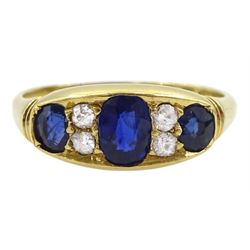 Victorian 18ct gold three stone oval sapphire ring, the central sapphire with two old cut diamonds set either side, Birmingham 1898, total sapphire weight approx 1.00 carat