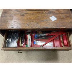 Six shelved cabinets for displaying ‘00’ gauge locomotives comprising plain plywood and white painted examples with track applied to various shelves, largest H63cm, W107cm, D27cm; Collection of tools for building model locomotives to include Weller PU-2D Soldering Pencil and Standard Tip Soldering Iron 20W/230V, Humbrol Modellers Airbrush, Power Supply Units and two wooden chests one of which housing a collection of tools including tweezers, scalping tools, wrenches etc 