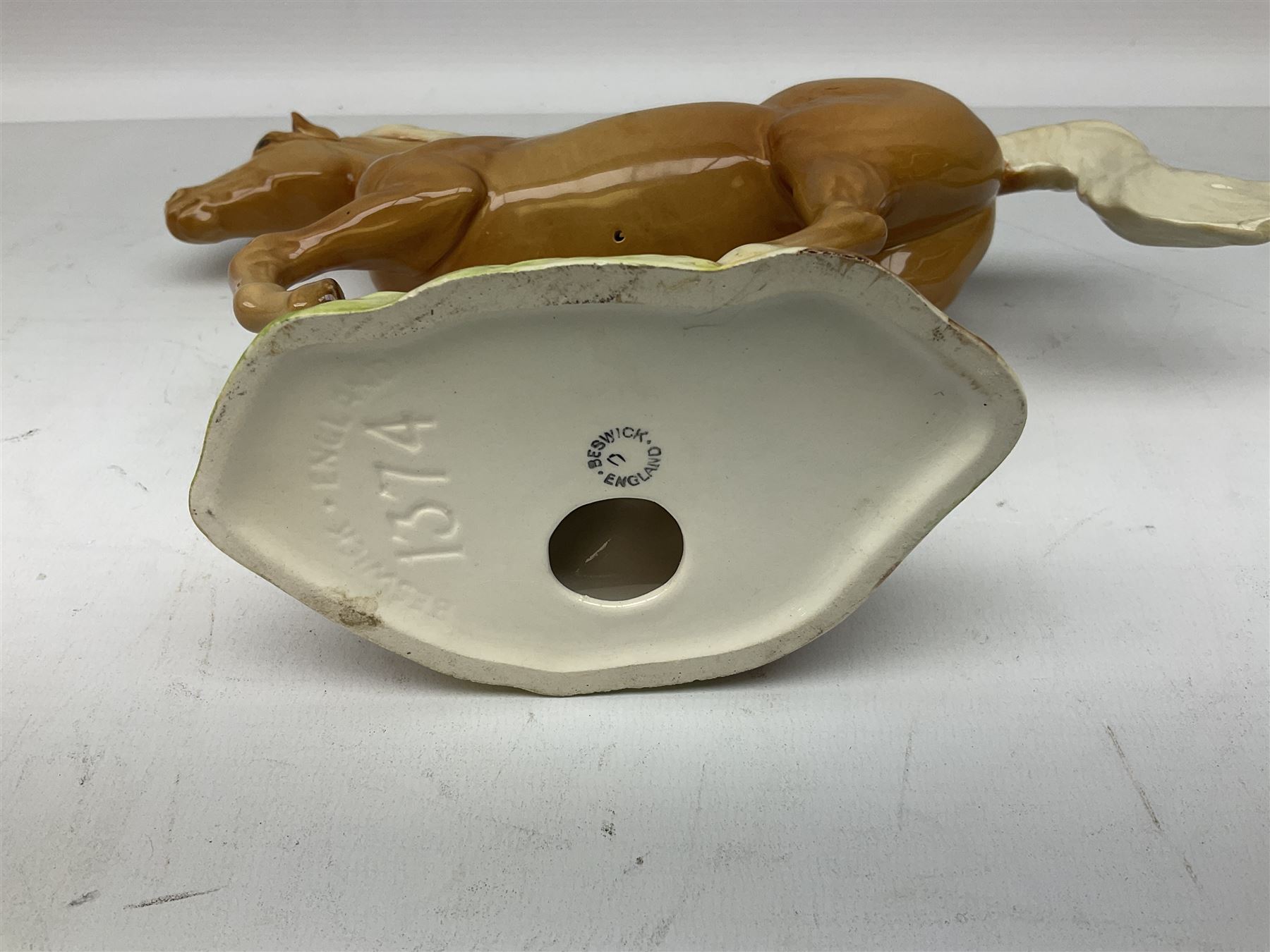 Beswick figure of cantering Palomino horse on base model no 1374, with impressed and printed mark beneath, H18cm
