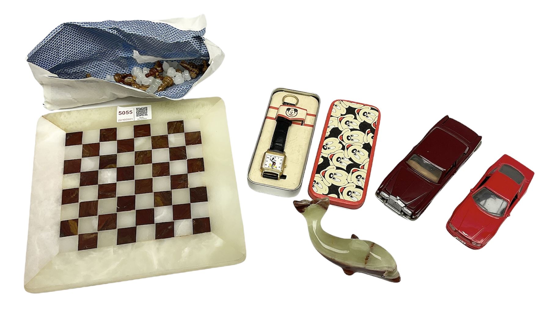 Onyx chess set, W21cm, Mickey Mouse watch in tin, Corgi Rolls Royce Corniche model, Aston Martin model and an onyx dolphin figure 