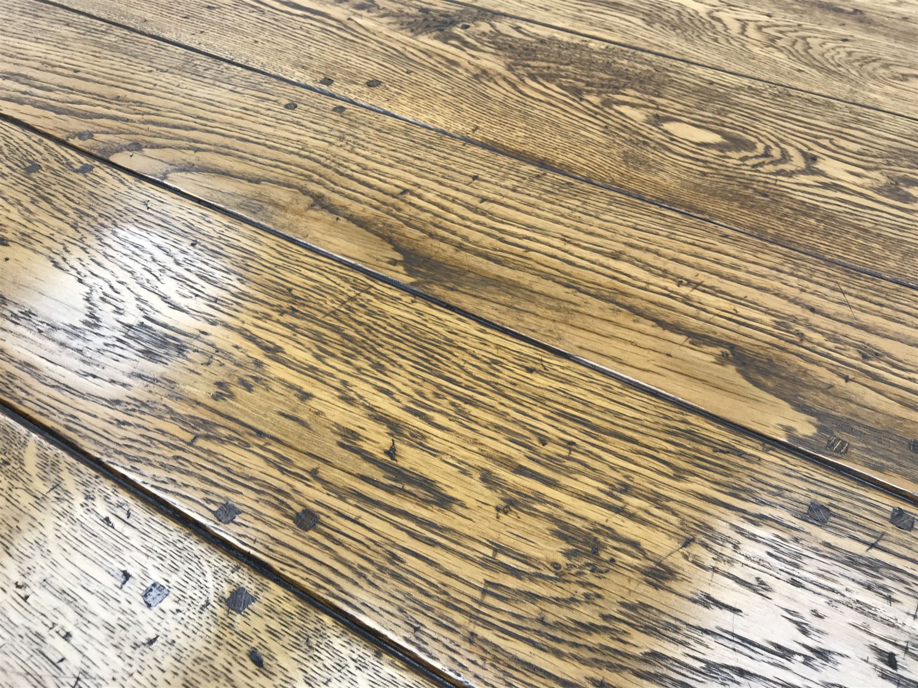 17th century style oval distressed light oak plank top dining table, rectangular stretcher base, L228cm, W150cm, H77cm