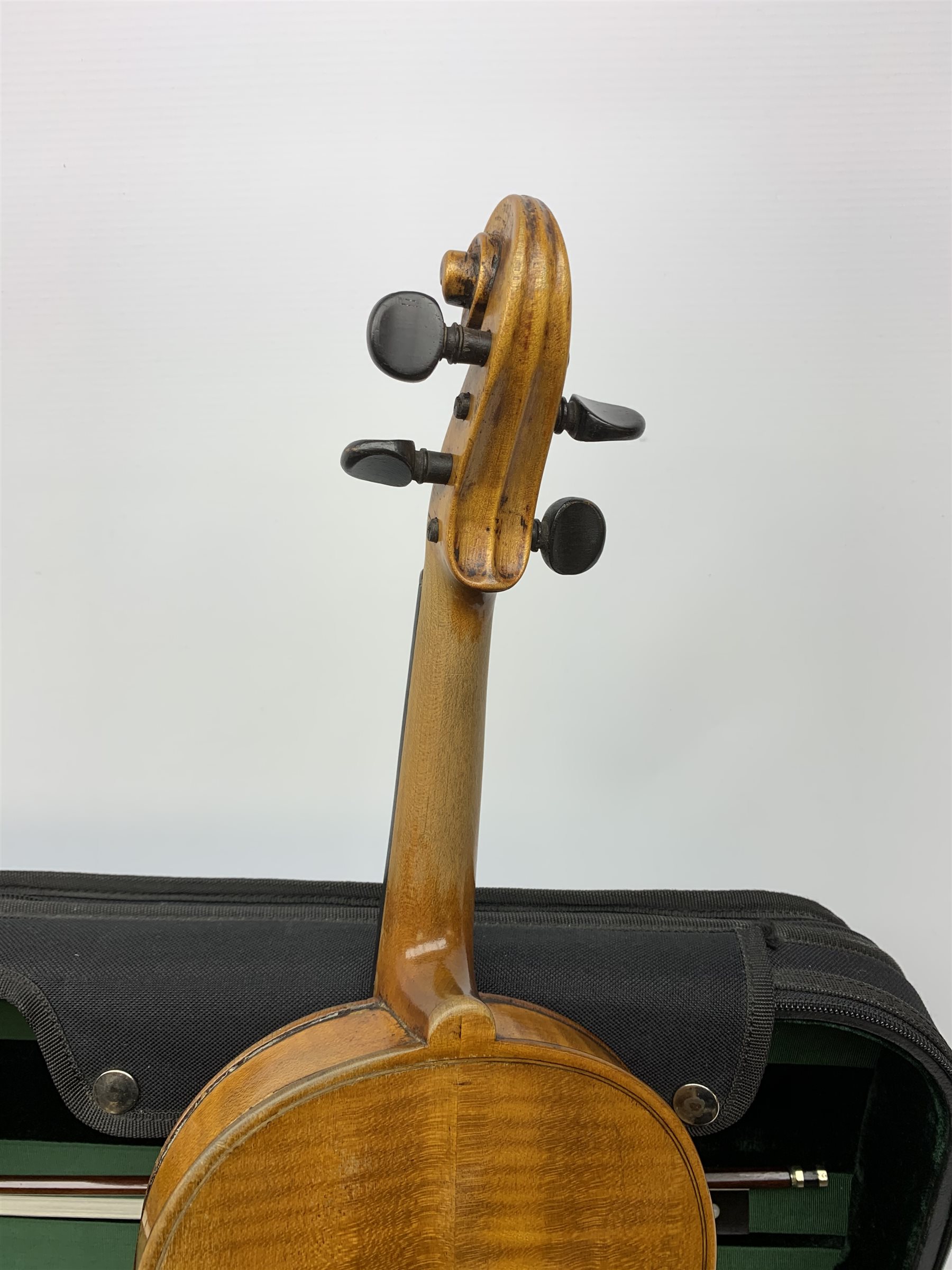 Late 19th century continental violin, possibly Italian, with 36cm two-piece maple back and ribs and spruce top, bears label 'Antonius Stradivarius Anno 1721', 60cm overall; in modern carrying case with silver mounted pernumbuco bow