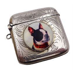 1920s silver vesta case, of typical form with engraved scroll decoration, with later applied ceramic circular plaque to front depicting a Boston Terrier, hallmarked F D Long, Birmingham 1920, H4.7cm