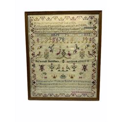 George III sampler, worked by  Susannah Sumpner, and dated 1800 lower right, depicting various motifs including crest, flowering urns, birds, and crows, between religious verse, within flowering vine border, framed and glazed, overall H44.5cm W37cm